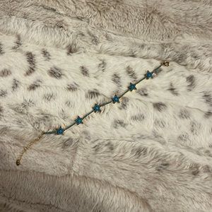Beautiful Blue Star bracelet with gold finishes. One size fits most